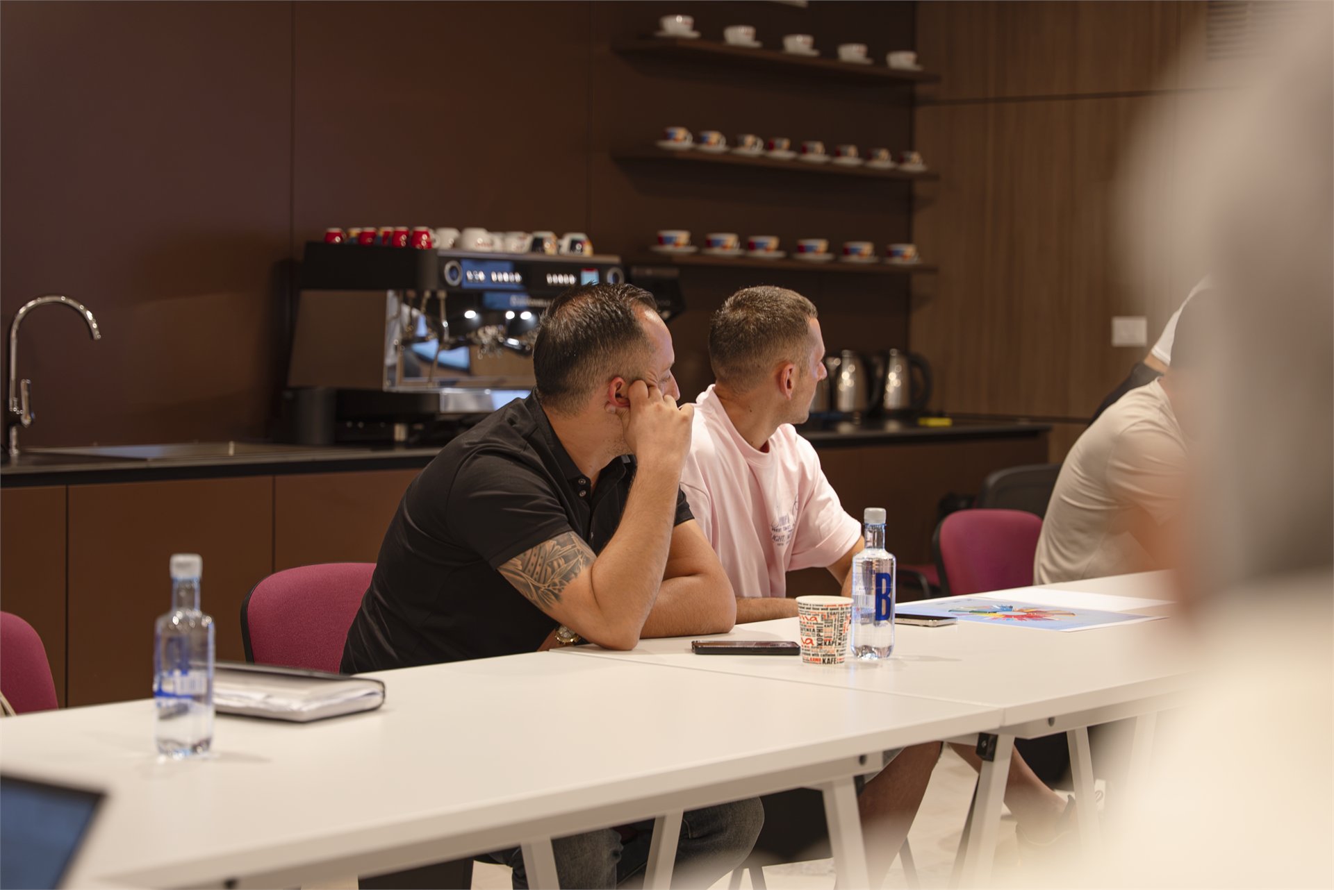 Participants listening during academy training