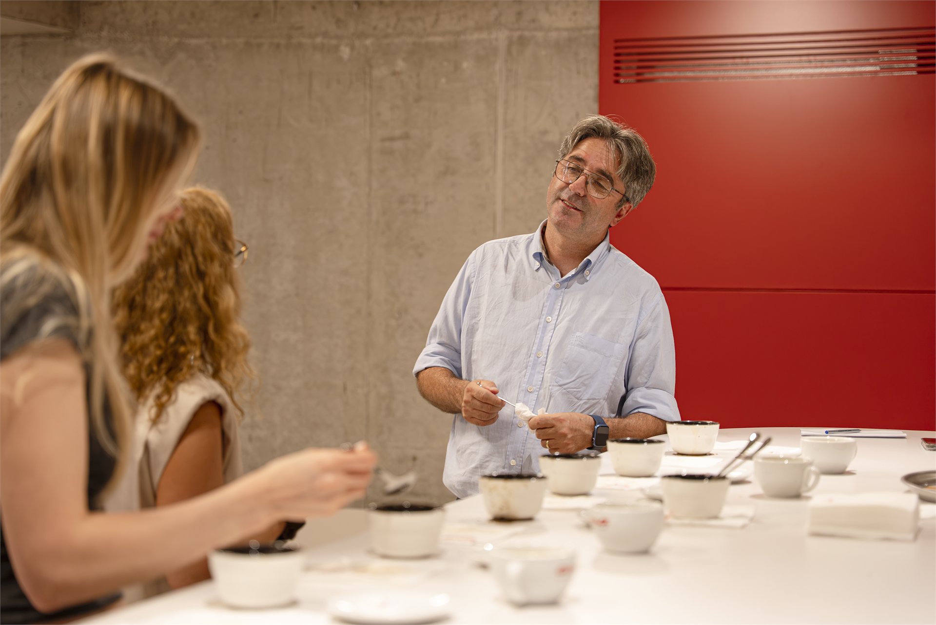 Trainer speaking with participants during cupping
